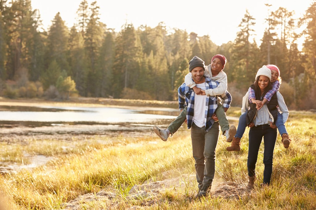 Family outdoors symbolizing protection through Life Insurance for children.